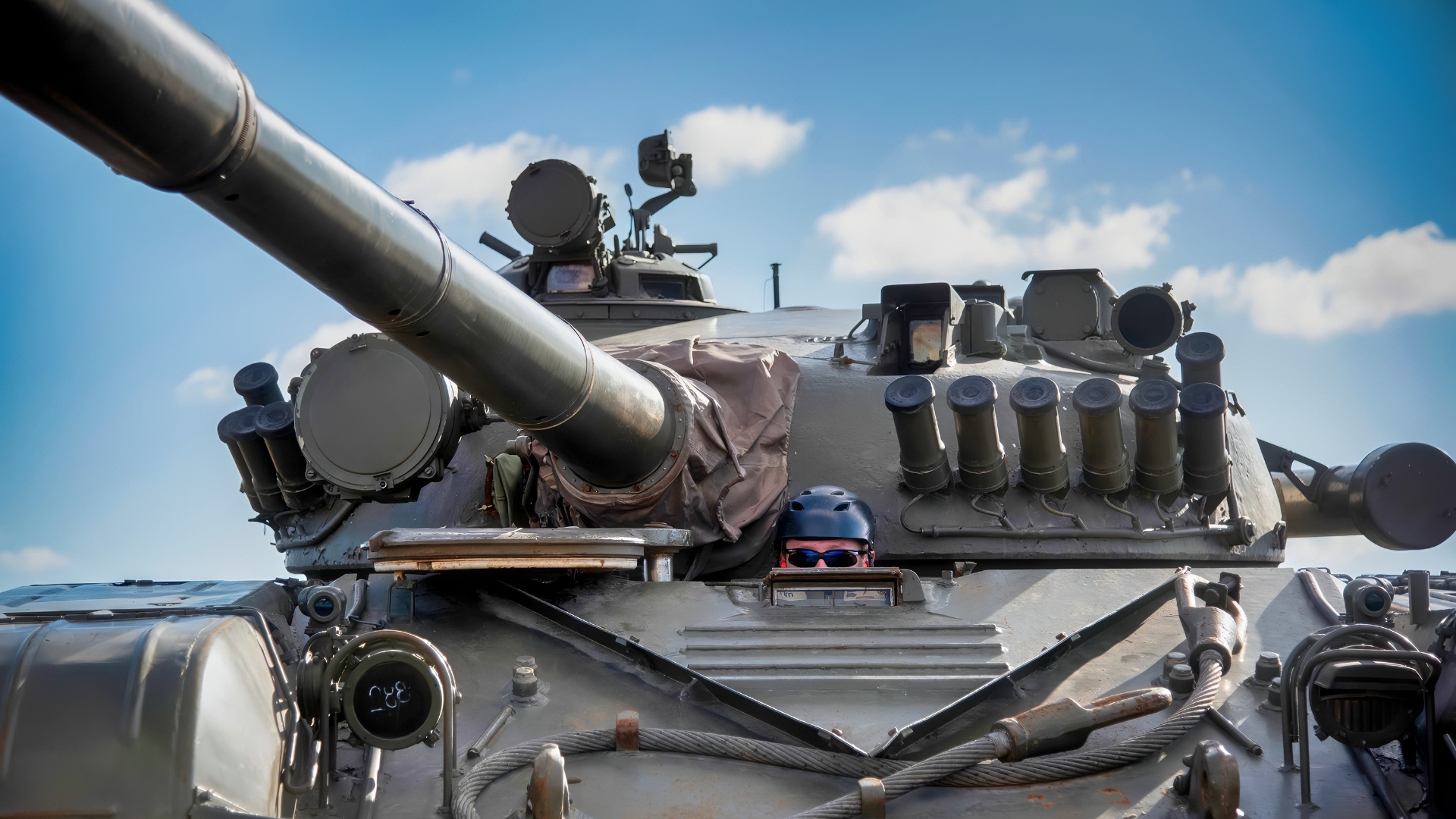 Tim Murry, a foreign threats compound contractor, drives a T-72 battle tank into position to serve as adversary targets for a joint service exercise, Emerald Flag, at Eglin Air Force Base, Fla., Nov. 30. Emerald Flag is a multi-service exercise aimed to unify information sharing across joint domain platforms. (U.S. Air Force photo/1st Lt Karissa Rodriguez)