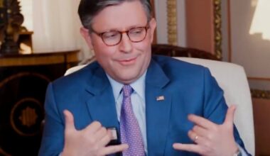 Mike Johnson Flashes Cringeworthy Gesture in Car Crash Interview