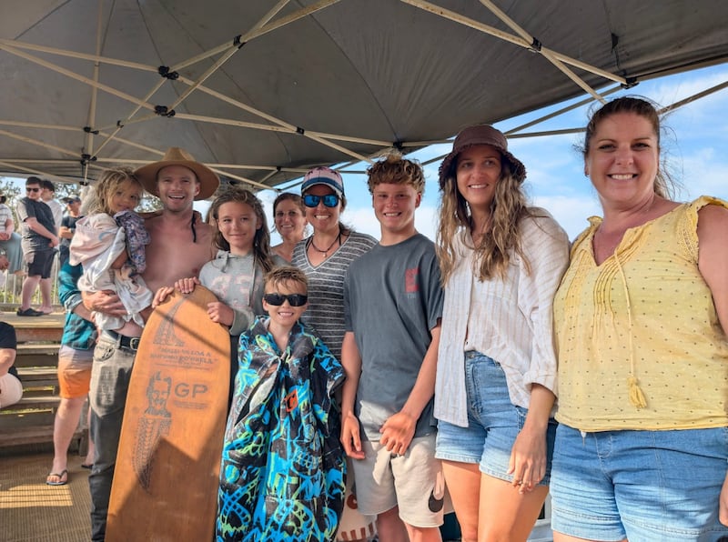 The Arvidson family from Cairns, Australia, receives the Greg Perritt Memorial Award from descendants of Greg Perritt during the 2025 Coffs Soul Surfest in Coffs Harbour Australia, September 2025.
