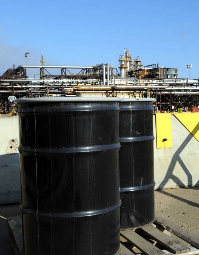 Two oil barrels on ground by Phototreat via iStock