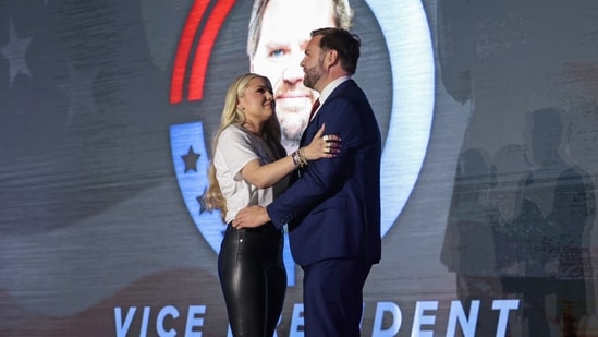 JD Vance and Erika Kirk's emotional embrace at a Turning Point USA event went viral, leading to discussions about their finances and generating the trending hashtag #ErikaAndJD.(AFP)