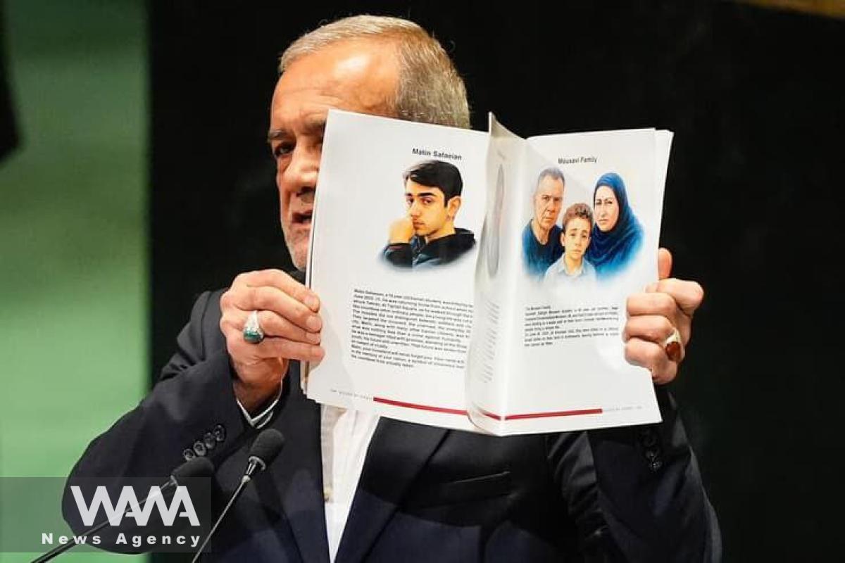 Pezeshkian displays images of those killed in Iran’s 12-day war at the UN. 24 Sep 2025. Social media / WANA News Agency