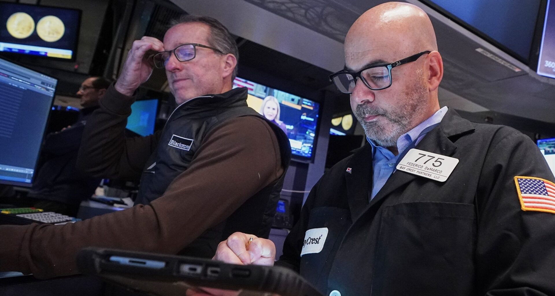 Wall Street swings through another unsettled day ahead of a crucial couple of tests