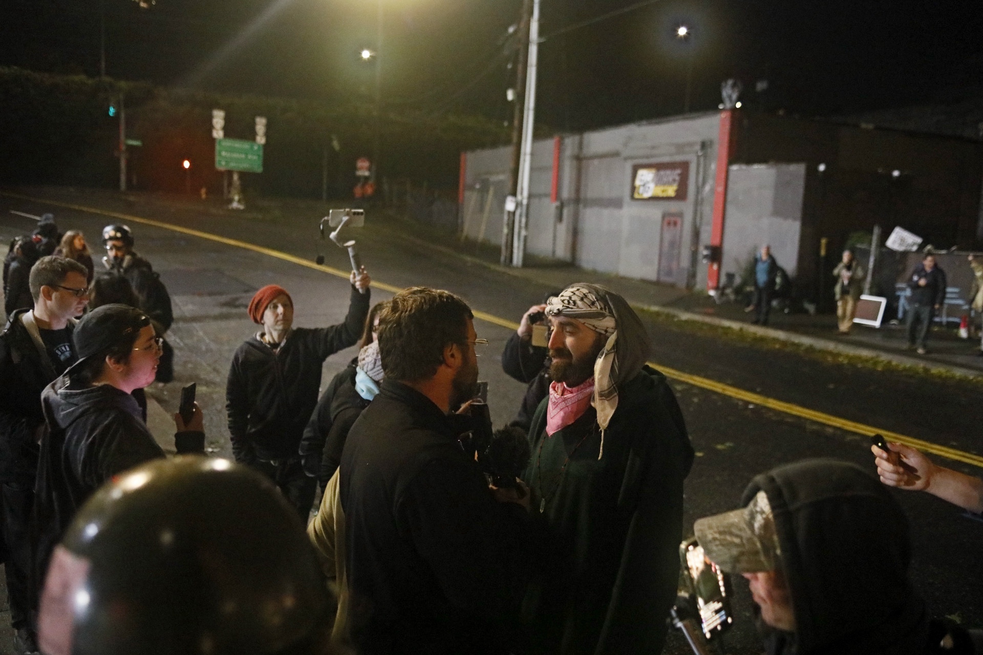 Protesters gather outside the Portland ICE facility on Sunday, Oct. 26, 2025.