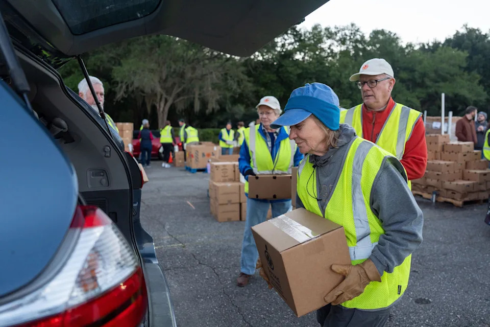 Hundreds of cars snaked through the Governors Square Mall parking lot to receive groceries as part of the Second Harvest of the Big Bend food drive on Saturday, Nov. 1, 2025. Nearly 100 volunteers loaded boxes of food, cartons of eggs, milk and more into the back of vehicles.