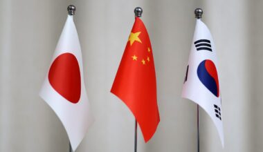Flags of Japan (left), China (middle) and South Korea. Photo: VCG