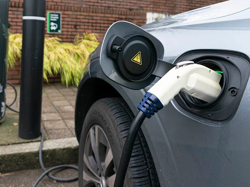 An electric vehicle at a charging station in a file photo.