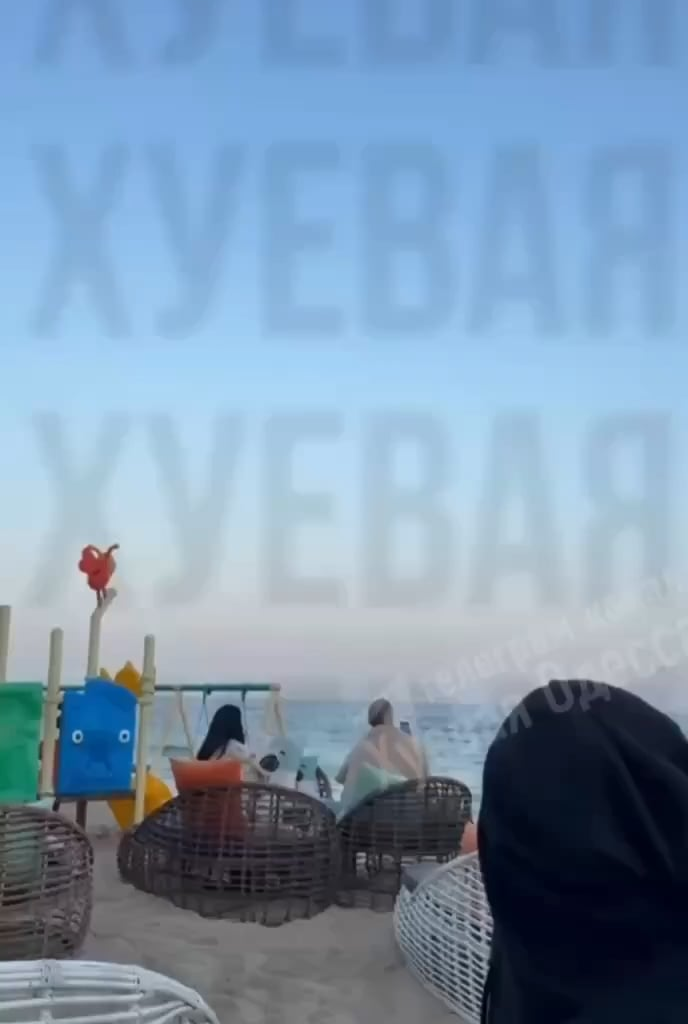Ukrainian civilians gathering at the beach in Odesa are watching their air defense shooting down Iranian/Russian "Shahed" UAVs attacking the city.