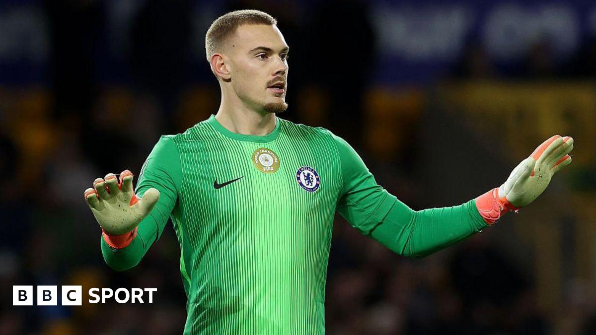 Filip Jorgensen gesturing for calmness to his defence against Wolves