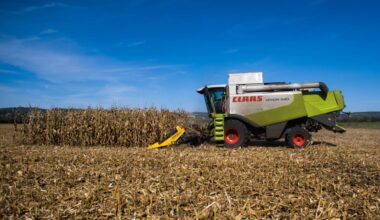 A combine harvester cuts through a field of corn during a harvest in Chateau Thierry, France.