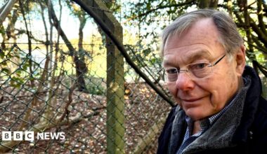 Family having a moment together messing about while winter sea swimming