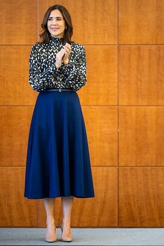 Queen Mary rewears print Jesper Høvring top with a blue mid skirt at the Independent Research Fund of Denmark conference
