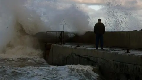 Reuters Waves crash on a pier in the coastal village of Cushendall, Northern Ireland
