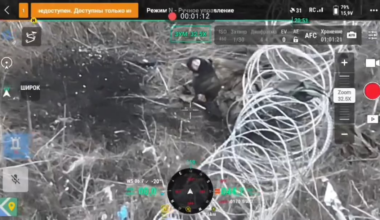 A Ukrainian FPV drone awaits the surrender of a russian soldier tangled up in barbed wire, he flips the drone off twice instead, upon which it engages him. November 2025.