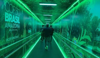 Passengers at a boarding gate showing the logo of the COP30 summit at Julio Cezar Ribeiro International Airport (Val-de-Cans) in Belem, Para State, Brazil, on November 23, 2025
