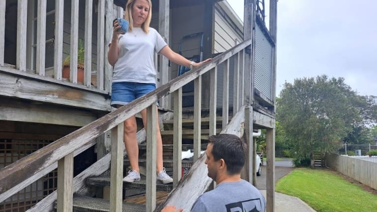 Brendon and Stephanie Deacon at their property that was considered category one by Auckland Council despite their neighbours all being category three following flooding.