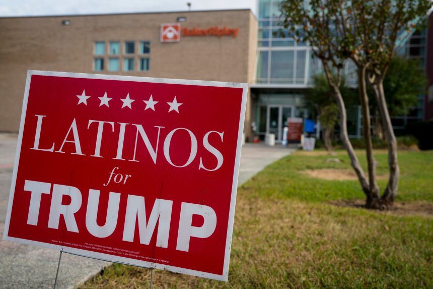 A Latinos for Trump campaign sign is photographed on Election Day on November 5, 2024 at BakerRipley Ripley House in Houston.