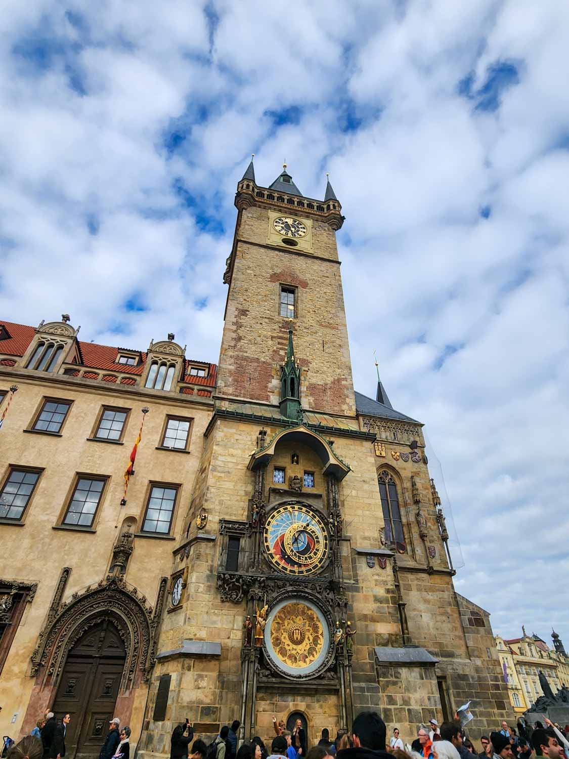 View of the old city hall with its astronomical clock on a sunny autumn day - one of the unmissable sights of Prague with kids