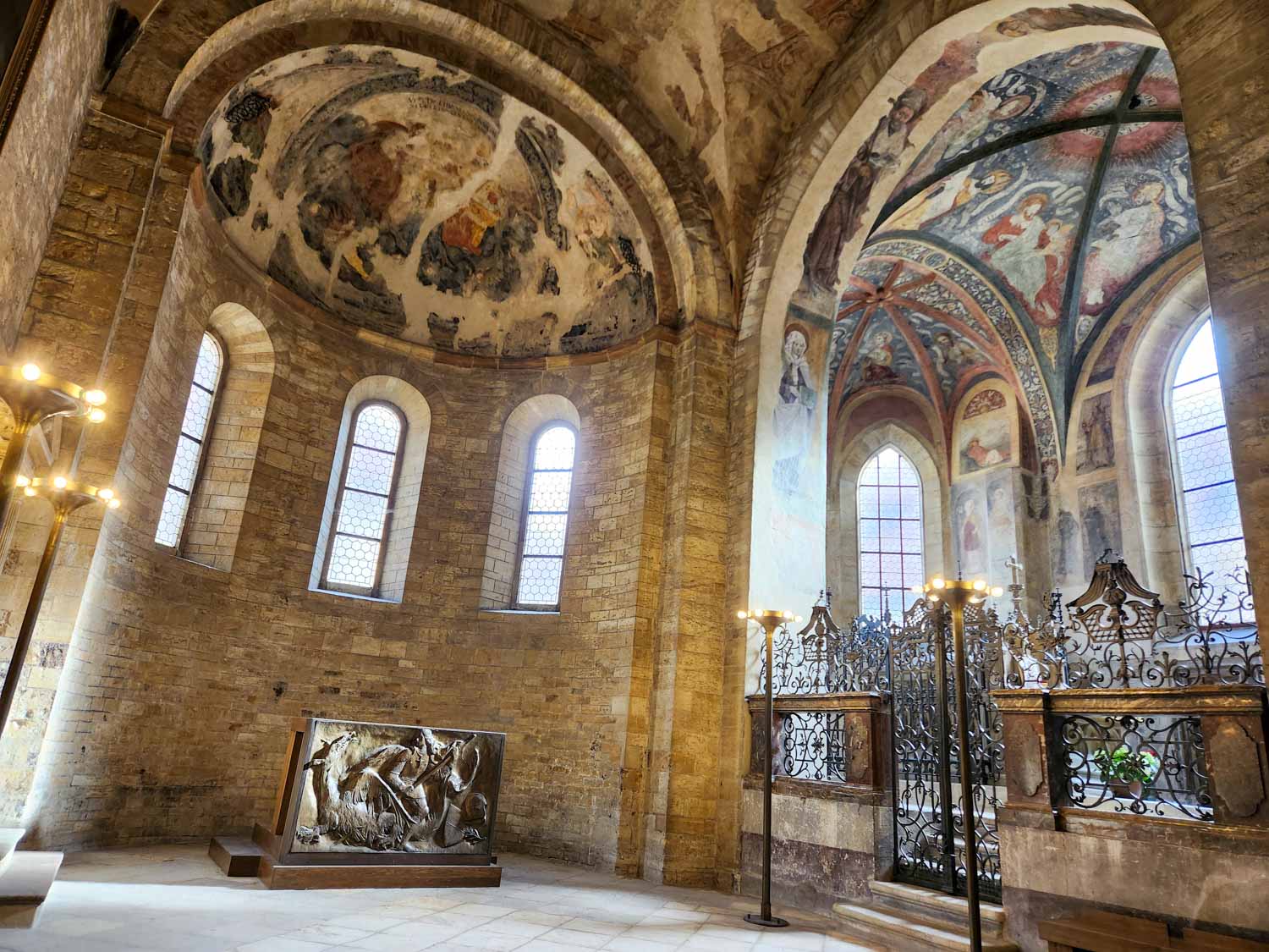 Domed chapels inside St George's basilica in the Prague Castle complex including a depiction of St George and the dragon