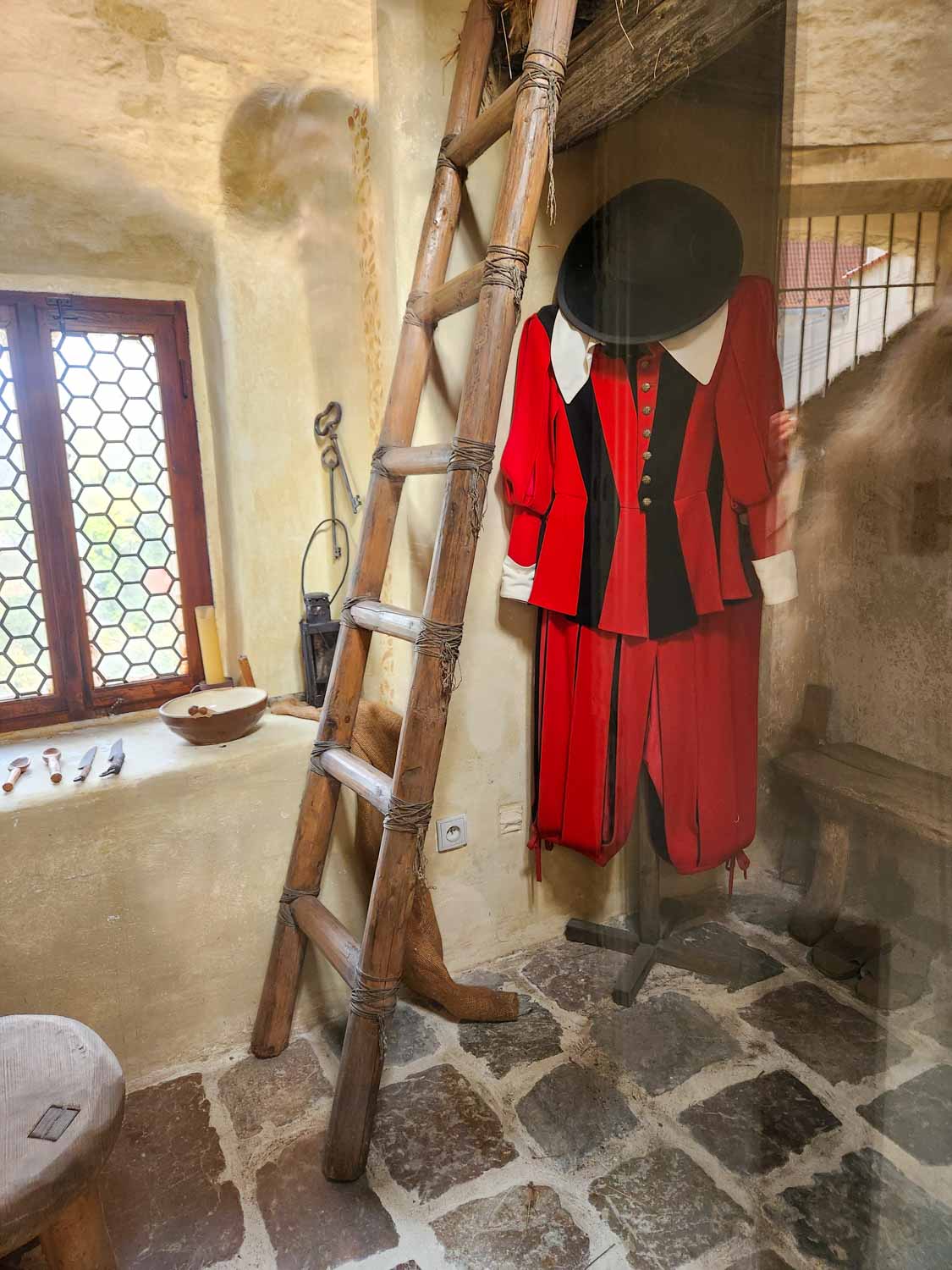 Guard's uniform hanging up inside one of the buildings on Golden Lane inside the Prague Castle complex, one of the best places to visit in Prague with kids