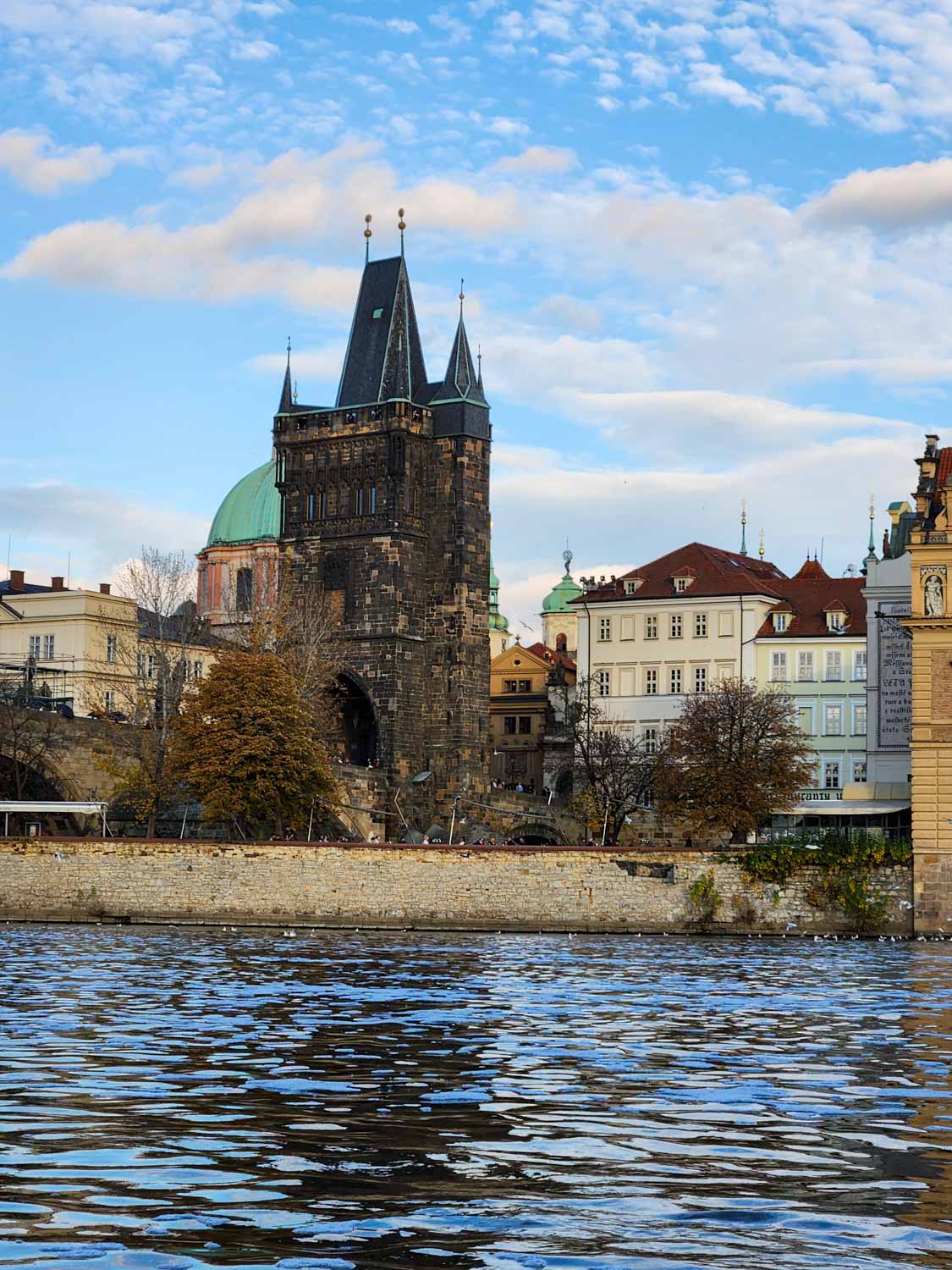 VIew of one of the towers at the end of the Charles Bridge during a visit to Prague with kids