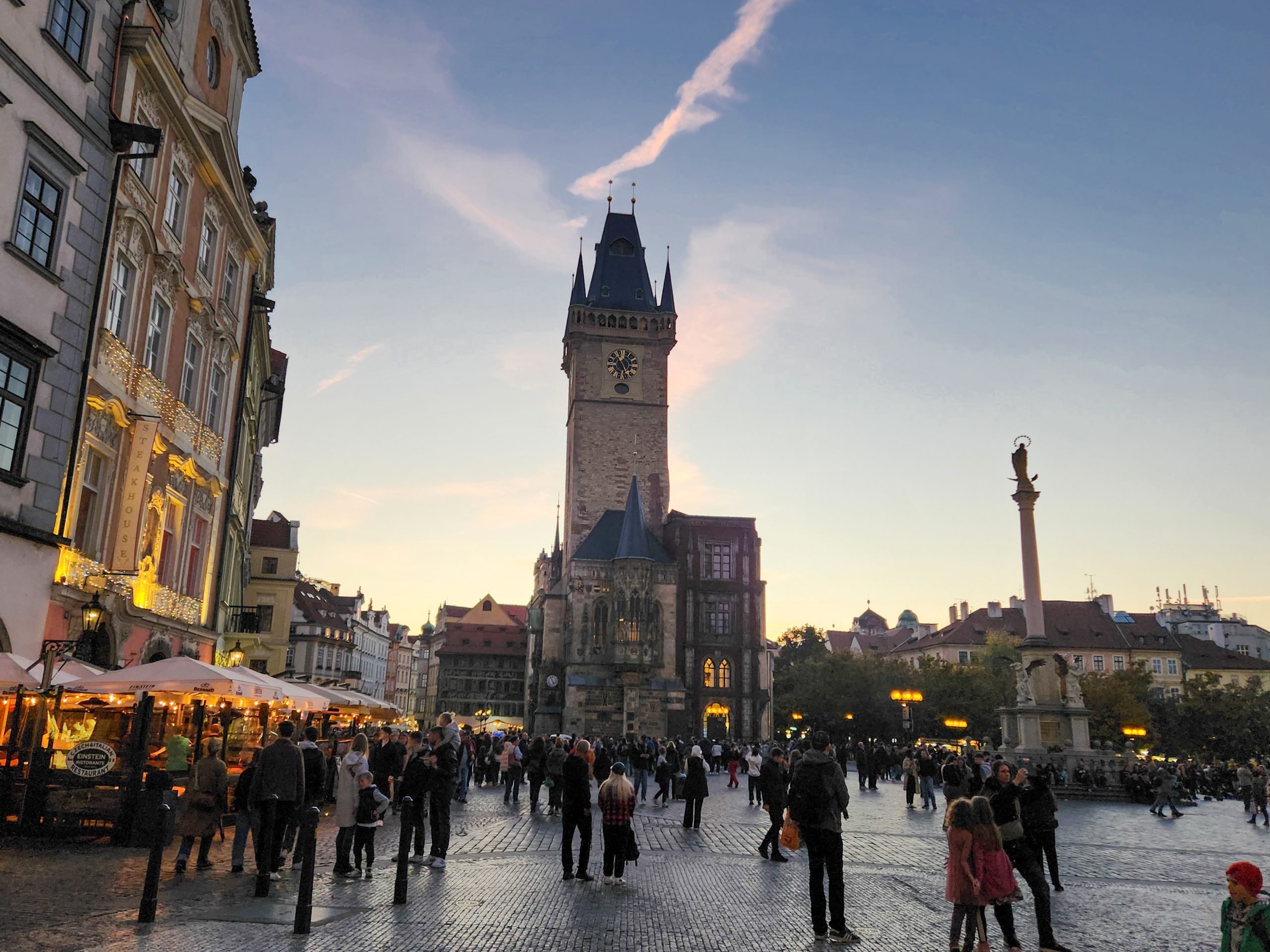 View across the Old Town Square around sunset, just before an evening walking tour of Prague with kids