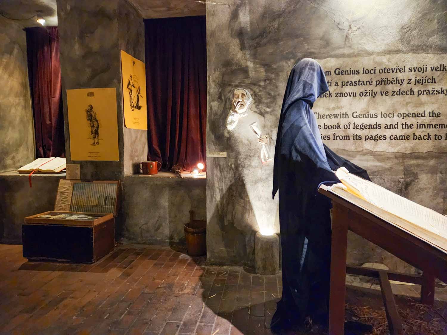 Hooded figure and displays at the Museum of Prague Ghosts and Legends - one of the most unusual things to do with kids in Prague