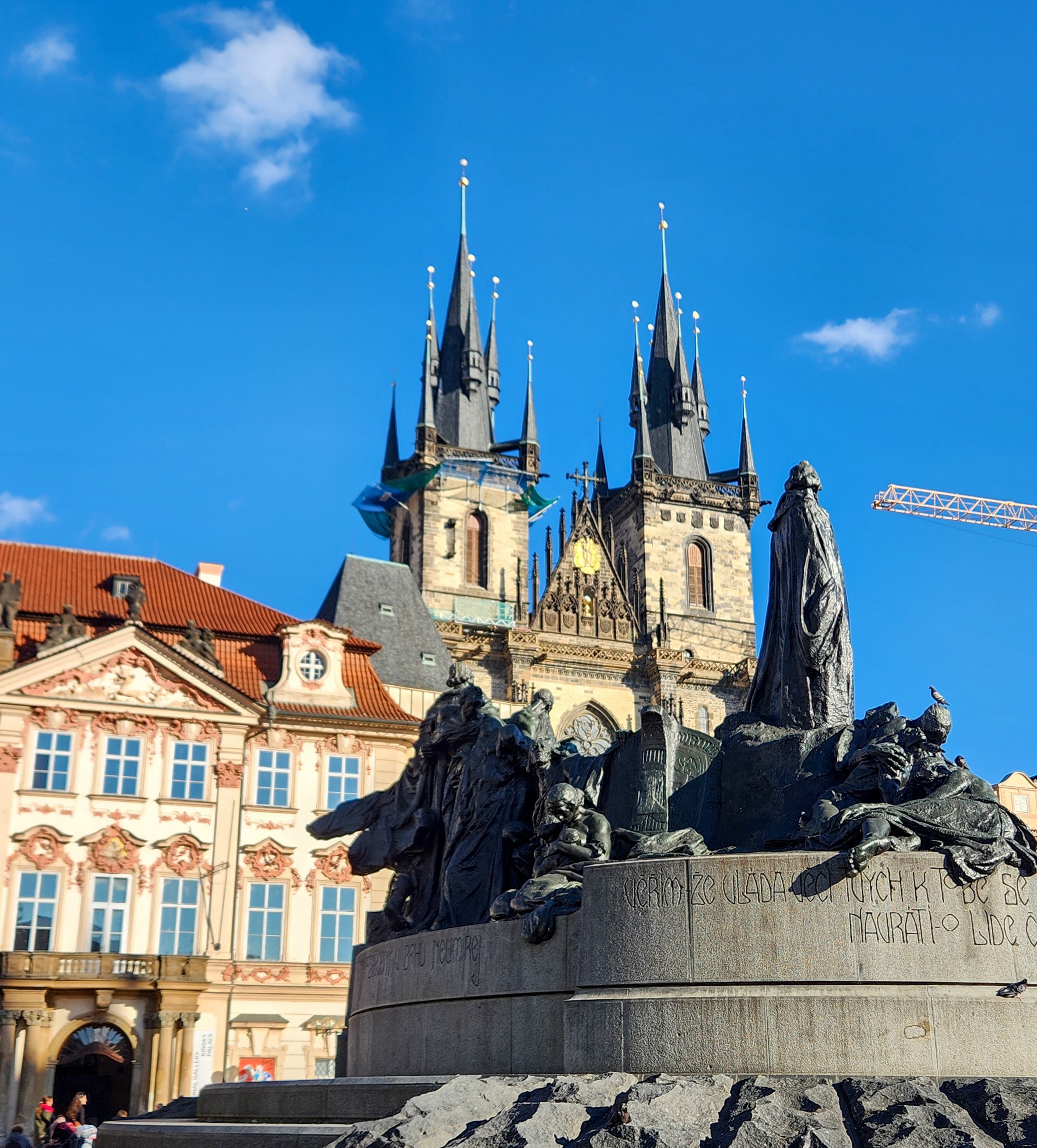 The Jan Hus monument with the Tyn church in the background at the Old Town Square - one of the unmissable places to visit in Prague with kids
