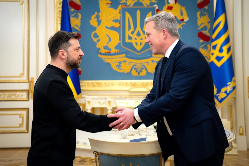 Ukrainian Presidential Press Office via AP - PHOTO: In this photo provided by the Ukrainian Presidential Press Office, Ukrainian President Volodymyr Zelenskyy, left, shakes hands with U.S. Secretary of the Army Dan Driscoll, in Kyiv, Ukraine, Nov. 20, 2025.