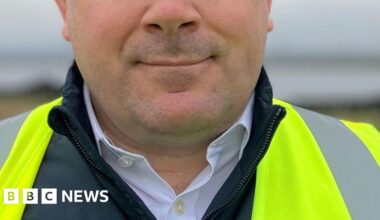 A man wearing a hi-vis jacket