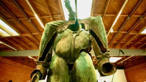 BBC Keith “Chuck” Tayman A modern reconstructed bronze statue of a headless horseman-type figure