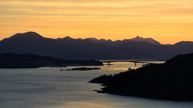 The Skye Bridge and jagged mountain peaks at sunset