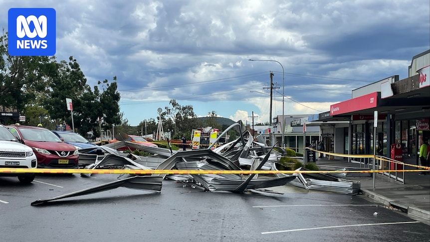 Man killed and 117,000 without power as storms lash Sydney and western NSW