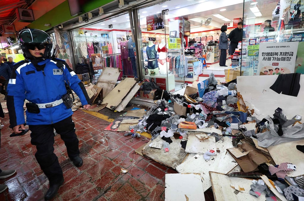 Police inspect the scene of the accident after a truck crashed into a local market in Bucheon on Thursday. Photo: Yonhap/AFP Police inspect the scene of the accident after a truck crashed into a local market in Bucheon on Thursday. Photo: Yonhap/AFP