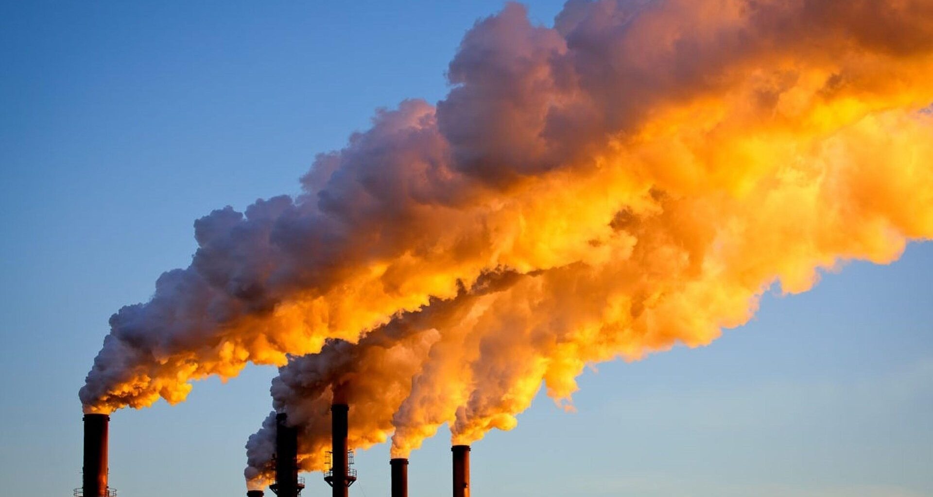 Factory chimneys sending smoke into the air