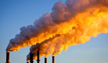 Factory chimneys sending smoke into the air