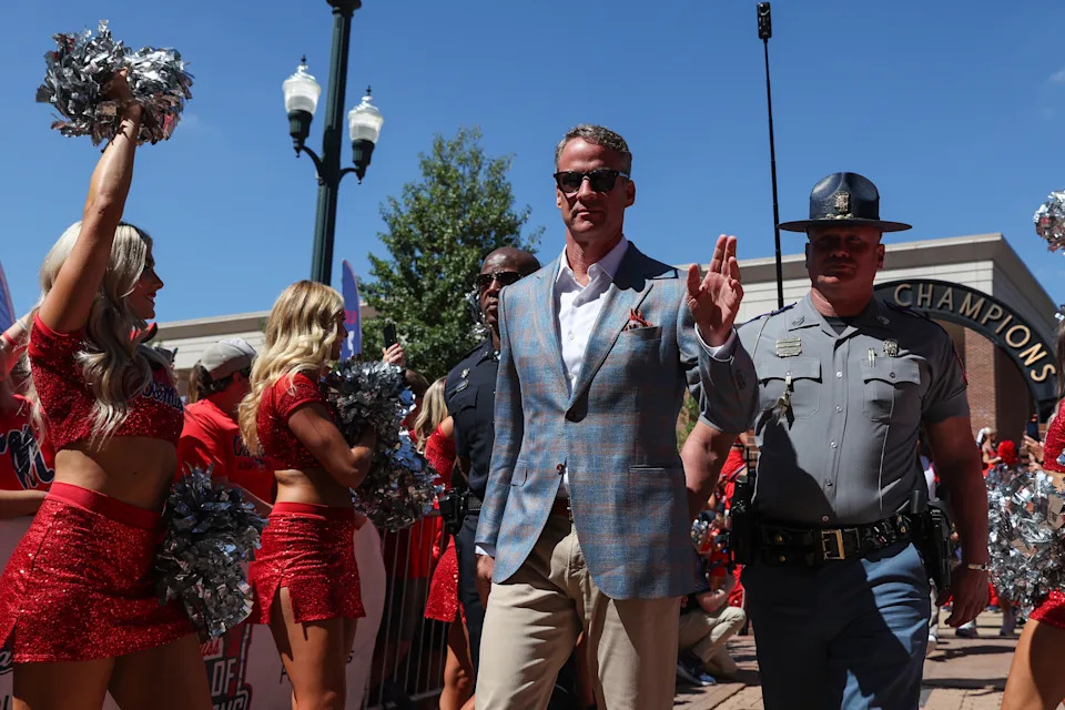 OXFORD, MISSISSIPPI - SEPTEMBER 27: Lane Kiffin, Head Coach of the Mississippi Rebels, waves at fans during the Walk of Champions before the college football game against the Louisiana State Tigers at Vaught-Hemingway Stadium on September 27, 2025 in Oxford, Mississippi. (Photo by Randy J. Williams/Getty Images)