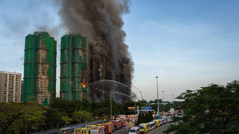 Firefighters try to extinguisha fire that broke out at Wang Fuk Court, a residential estate in the Tai Po district of Hong Kong's New Territories.