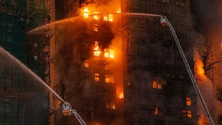 Firefighters work to extinguisha fire that broke out at Wang Fuk Court, a residential estate in the Tai Po district of Hong Kong's New Territories.