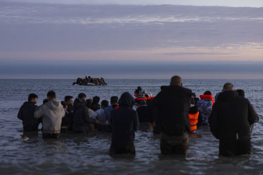 Migrants wait to board a small boat to cross the English Channel from Gravelines, northern France, on September 19.
