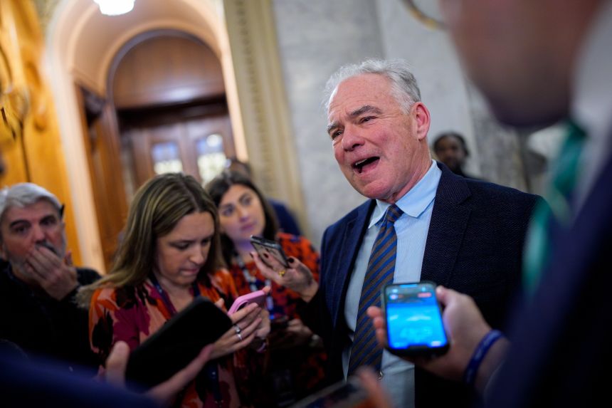 Sen. Tim Kaine speaks to reporters as he arrives for votes on Capitol Hill on November 10, 2025.