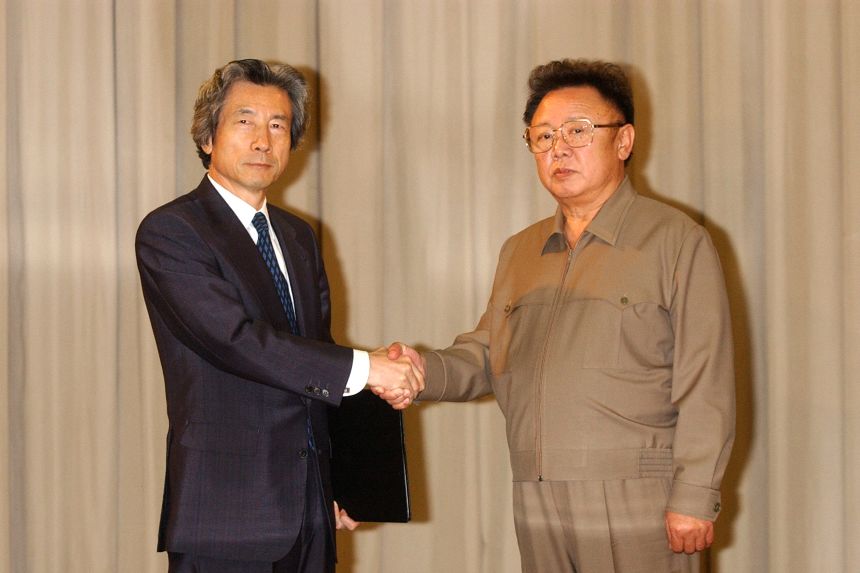 Japanese Prime Minister Junichiro Koizumi and North Korean leader Kim Jong-Il shake hands after meeting in Pyongyang, North Korea, on September 17, 2002.