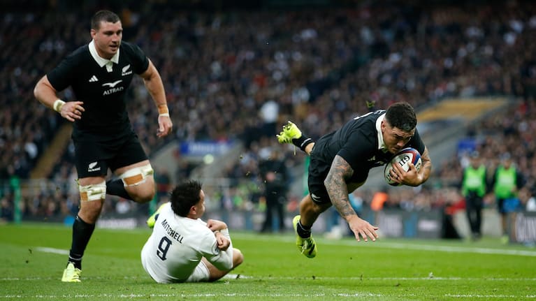 Hooker Codie Taylor dives over for the All Blacks' second try at Twickenham.