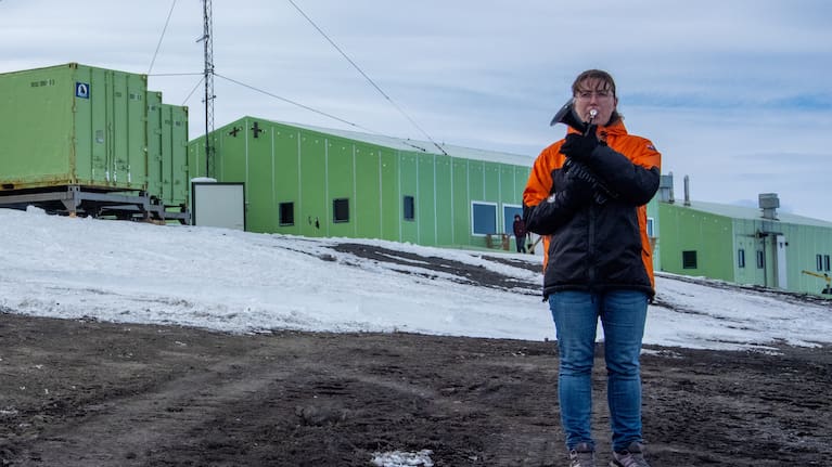In this photo provided by Antarctica New Zealand, Natalie Paine plays a plastic French horn at Scott Base in Antarctica