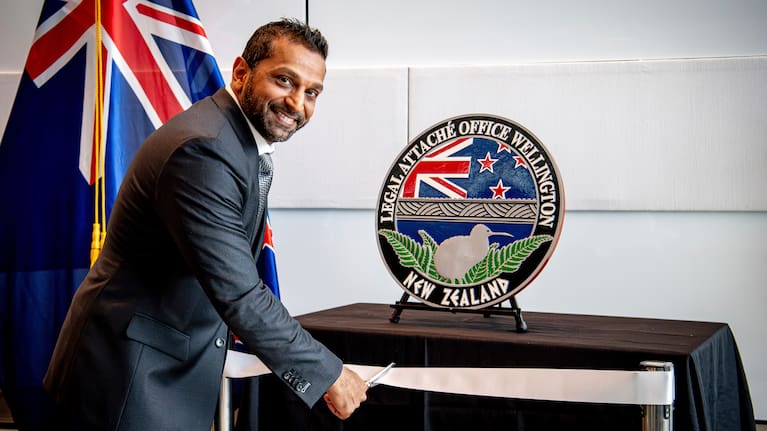 In this photo released by the US Embassy in Wellington, New Zealand, FBI Director Kash Patel cuts the ribbon at the official opening of the FBI office in Wellington, New Zealand, July 31, 2025.