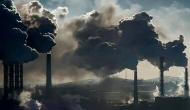 Smoke billows from industrial stacks on the outskirts of an Iranian city during a week of hazardous air pollution