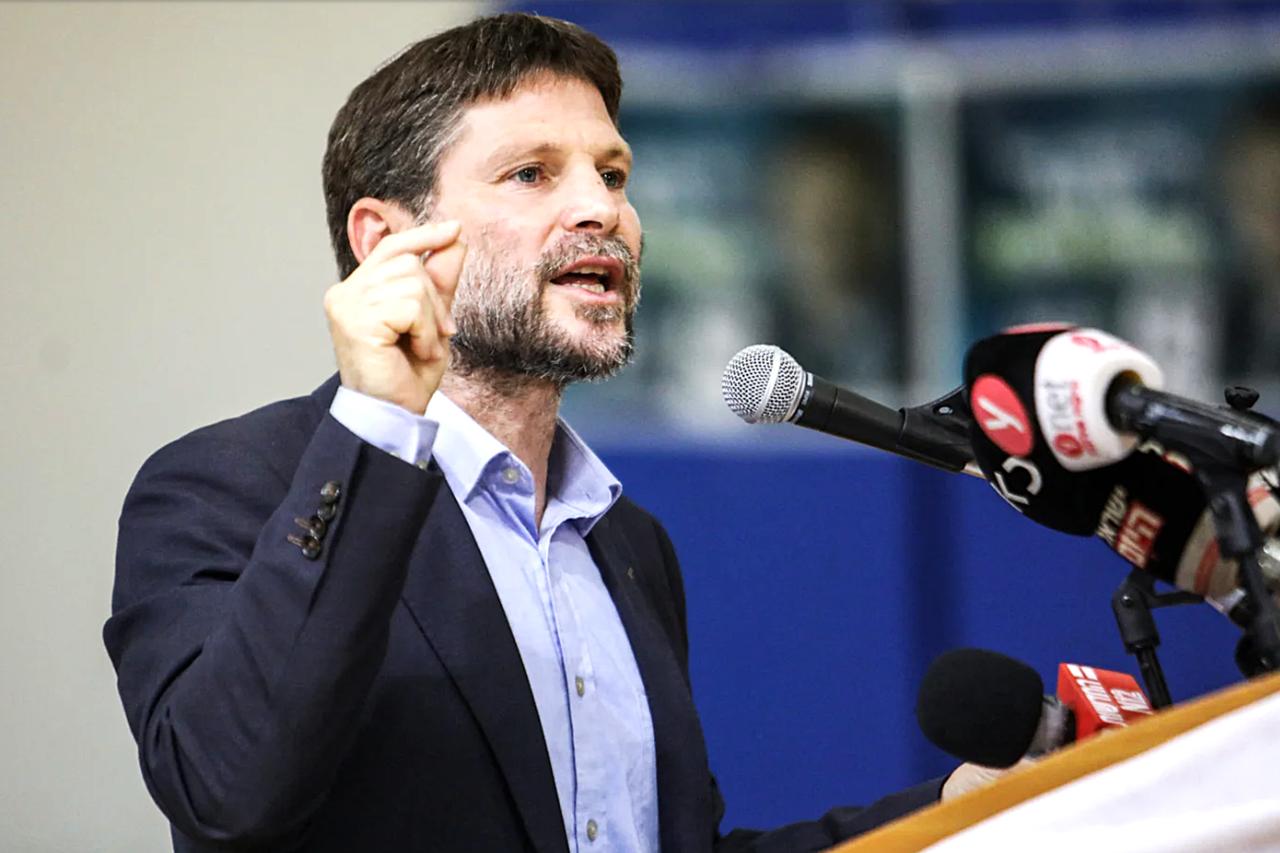 Bezalel Smotrich, a far-right Israeli lawmaker and leader of the Religious Zionism party, speaks during a rally with supporters in the southern Israeli city of Sderot, 26 October 2022 (AFP)
