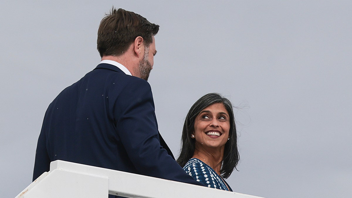 JD Vance and Usha Vance looking at one another