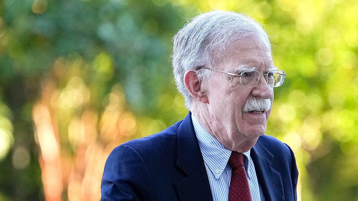 John Bolton walks into a federal courthouse.