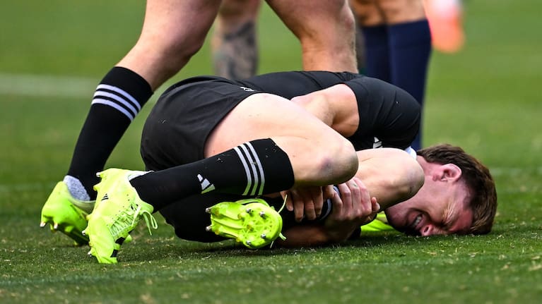 Jordie Barrett winces in pain after hurting his leg during the All Blacks' win over Ireland.